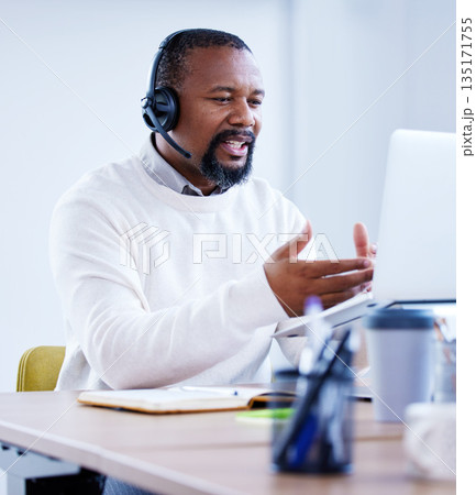 Laptop, call center agent and black man in office for customer service. Mature, contact us and African male sales consultant, telemarketing employee and consulting for tech support, crm or advice. 135171755