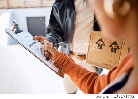 Closeup, courier and woman with a package, sign and shipping with a box, clipboard and documents. Zoom, female person and employee with paperwork, delivery and customer receive parcel and writing Closeup, courier and woman with a package, sign and shipping with a box, clipboard and documents. Zoom, female person and employee with paperwork, delivery and customer receive parcel and writing 135171772