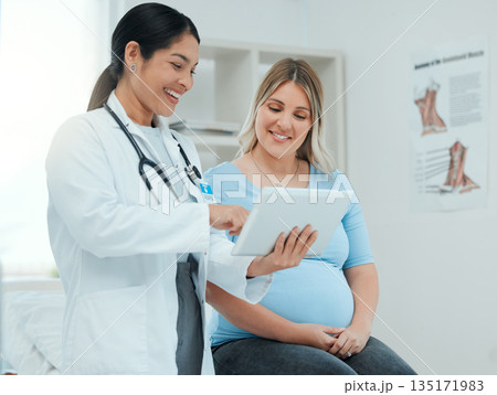 Healthcare, tablet and pregnant woman at a prenatal consultation for health in a medical clinic. Wellness, maternity and female pregnancy doctor speaking to a mother with a digital mobile in hospital Healthcare, tablet and pregnant woman at a prenatal consultation for health in a medical clinic. Wellness, maternity and female pregnancy doctor speaking to a mother with a digital mobile in hospital 135171983
