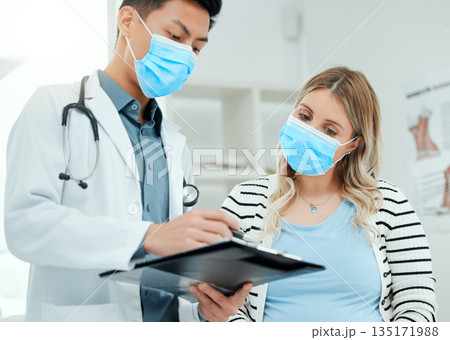 Healthcare, woman and doctor with a clipboard, consultation and conversation for diagnosis. Female person, patient or medical professional with a document, explain insurance or symptoms in a hospital 135171988