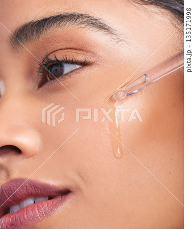 Beauty serum, woman and skincare closeup with dermatology and face cleaning. Wellness, hyaluronic acid and young female model with skin glow product and treatment with care and dropper in studio Beauty serum, woman and skincare closeup with dermatology and face cleaning. Wellness, hyaluronic acid and young female model with skin glow product and treatment with care and dropper in studio 135171998