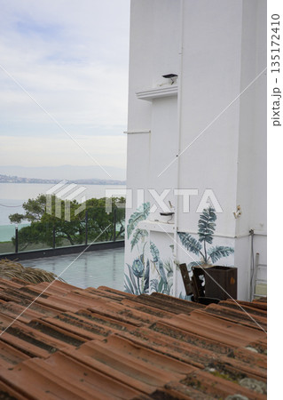 Rustic brown tile roof and sea view 135172410