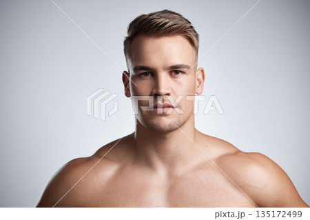 Portrait, serious fitness and strong man on studio, background and backdrop for power, athletic confidence and athlete. Face, muscular bodybuilder and topless male model with muscles for sports pride 135172499