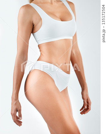 Body, diet and woman in lingerie in studio for wellness, health and lose weight on white background. Underwear, detox and female model with cosmetic, treatment and glowing, skin and slimming results 135172504
