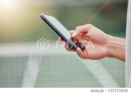 Man, hands and phone on tennis court for social media, communication or networking outdoors. Closeup hand of man typing, texting or chatting on mobile smartphone, screen or display with mockup space Man, hands and phone on tennis court for social media, communication or networking outdoors. Closeup hand of man typing, texting or chatting on mobile smartphone, screen or display with mockup space 135172626