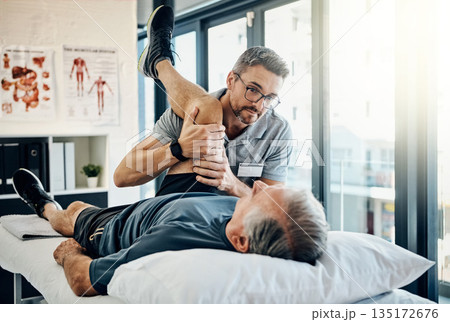 Stretching legs, help and a physiotherapist with a man for wellness and recovery support. Rehabilitation, health and a male doctor helping an elderly person with physiotherapy on body muscle 135172676
