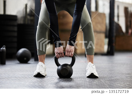 Kettle bell, fitness and woman in gym for weightlifting, bodybuilder training and strong muscles. Healthy body, weights and hands of female person in sport center for wellness, exercise and workout Kettle bell, fitness and woman in gym for weightlifting, bodybuilder training and strong muscles. Healthy body, weights and hands of female person in sport center for wellness, exercise and workout 135172719
