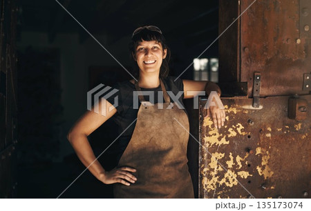 Woman blacksmith, portrait and smile in factory, industry and trade for entrepreneurship at artisan job. Small business owner, female entrepreneur and labor in industrial warehouse with manufacturing 135173074