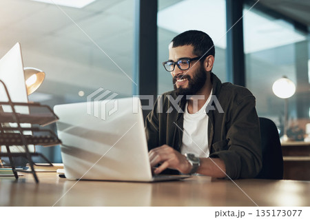 Smile, work and a businessman with a laptop for an email, communication or online coding. Happy, programming and a male programmer typing on a computer for web or software development in an office 135173077