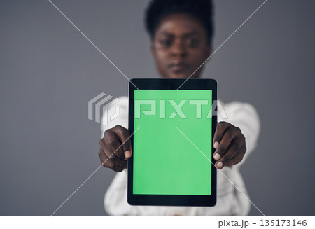 Green screen, tablet and woman in portrait isolated on a studio background for advertising space or mockup. Online mock up, website design and african person with digital technology and application 135173146