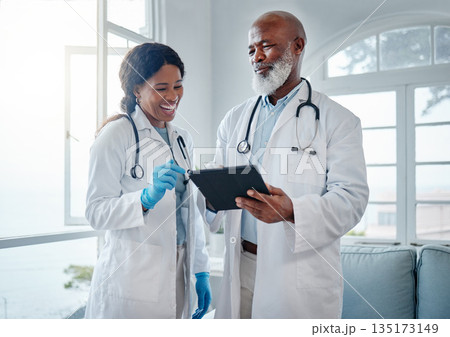 African doctors, teamwork and smile with tablet, comic or conversation for team building in hospital. Senior black man, woman and medical discussion with digital touchscreen, social media and clinic African doctors, teamwork and smile with tablet, comic or conversation for team building in hospital. Senior black man, woman and medical discussion with digital touchscreen, social media and clinic 135173149