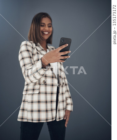 Young business woman, selfie and smile by wall background with fashion, happiness and creativity on social media app. Indian businesswoman, photography and profile picture with pride, happy and blog Young business woman, selfie and smile by wall background with fashion, happiness and creativity on social media app. Indian businesswoman, photography and profile picture with pride, happy and blog 135173172