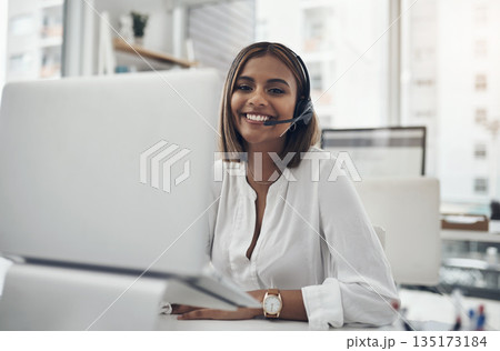 Smile, headset and portrait of a woman in a call center for customer service, telemarketing or help desk. Female person, consultant or agent with laptop for contact us, support or crm at a company Smile, headset and portrait of a woman in a call center for customer service, telemarketing or help desk. Female person, consultant or agent with laptop for contact us, support or crm at a company 135173184