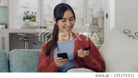 Happy woman, credit card and online shopping on smartphone in home for digital payment, fintech or money transfer. Female, mobile banking and finance of cash, web sales and password for financial app Happy woman, credit card and online shopping on smartphone in home for digital payment, fintech or money transfer. Female, mobile banking and finance of cash, web sales and password for financial app 135173312