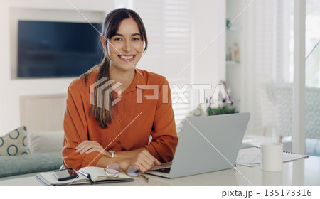 Happy woman, remote work and portrait at laptop in home for digital planning, online research and elearning at table. Female freelancer working on computer, technology and web connection for blogging 135173316