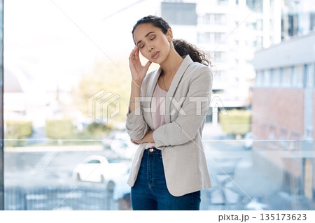 Headache, stress and business woman in office for frustrated, tired and anxiety. Burnout, mental health and corporate with female employee and pain at window for mistake, problem and overworked Headache, stress and business woman in office for frustrated, tired and anxiety. Burnout, mental health and corporate with female employee and pain at window for mistake, problem and overworked 135173623