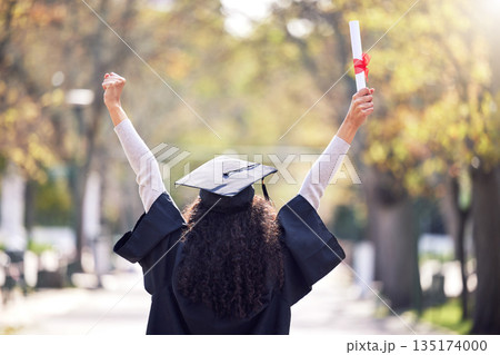 Graduation, back and woman student celebrating academic success or raising her diploma or victory at university campus with cheers. Motivation, certificate and achievement for happy female person 135174000