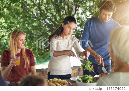 Food, salad and help with family at lunch in nature for health, bonding and celebration. Vacation, barbecue and event with parents and children eating together for garden, generations and wellness Food, salad and help with family at lunch in nature for health, bonding and celebration. Vacation, barbecue and event with parents and children eating together for garden, generations and wellness 135174022