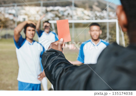 Sports team, red card and soccer referee outdoor on field for game foul, mistake or compliance. Football player, athlete club and paper in person hand for sport warning, penalty rules or dismissal Sports team, red card and soccer referee outdoor on field for game foul, mistake or compliance. Football player, athlete club and paper in person hand for sport warning, penalty rules or dismissal 135174038