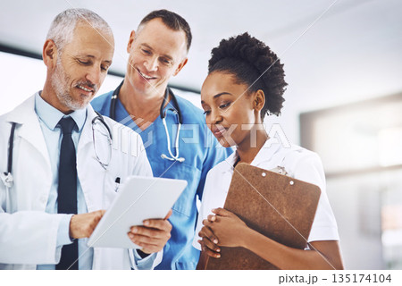 Senior doctor, tablet and coaching team in healthcare for research, teamwork or meeting at hospital. Happy elderly medical professional training staff on technology in group collaboration at a clinic Senior doctor, tablet and coaching team in healthcare for research, teamwork or meeting at hospital. Happy elderly medical professional training staff on technology in group collaboration at a clinic 135174104