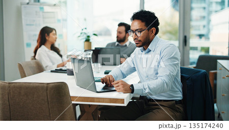 Serious, employee and man with laptop, office and research for wealth management, typing and online. Digital, info and person with tech for project, financial analyst and planning for annual budget 135174240