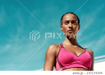 Sports, fitness and serious woman with blue sky mockup at outdoor gym for health and wellness. Workout, exercise and female athlete with focus, power and healthy mindset for summer goals with space. 135174344