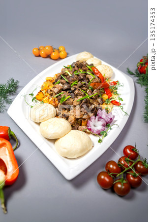 Top view of national Kazakh dish Kuurdak - braised meat with potatoes 135174353