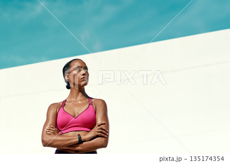 Sports, fitness and serious woman with blue sky, mockup at outdoor gym for health and wellness. Workout, exercise and confidence, fit athlete with focus space and healthy mindset for summer goals. Sports, fitness and serious woman with blue sky, mockup at outdoor gym for health and wellness. Workout, exercise and confidence, fit athlete with focus space and healthy mindset for summer goals. 135174354