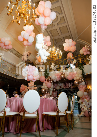 Wide shot of luxurious hall with balloon arches and teddy bears, decor for childrens party Wide shot of luxurious hall with balloon arches and teddy bears, decor for childrens party 135174382