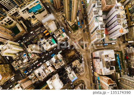 Skyscraper, architecture and aerial view of city buildings in Hong Kong in street. Urban landscape, cityscape building and drone of skyscrapers, infrastructure and property in metropolis of cbd. Skyscraper, architecture and aerial view of city buildings in Hong Kong in street. Urban landscape, cityscape building and drone of skyscrapers, infrastructure and property in metropolis of cbd. 135174390