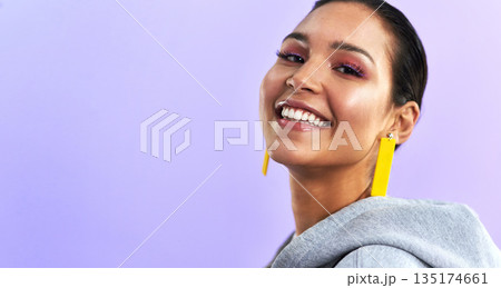 Young woman, portrait and makeup with jewelry, happiness and mockup in studio. Purple background, female person and gen z fashion with face and millennial style with a smile and beauty cosmetics 135174661