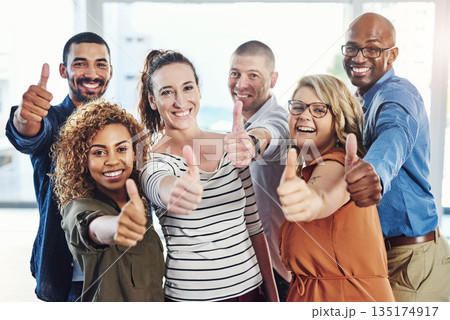 Yes, thumbs up portrait and business people with diversity, winner and thank you like sign of staff. Office, happiness and success of worker group with support, teamwork and motivation for company Yes, thumbs up portrait and business people with diversity, winner and thank you like sign of staff. Office, happiness and success of worker group with support, teamwork and motivation for company 135174917