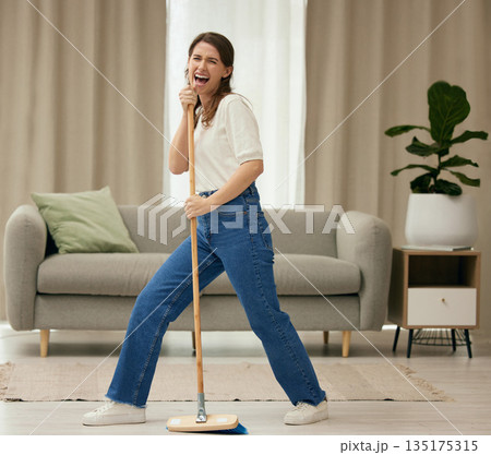 Woman, singing and broom to clean living room with funny dance, sweeping floor or performance in home. Girl, comic singer and cleaner with spring cleaning, music or working to stop dust, dirt and job Woman, singing and broom to clean living room with funny dance, sweeping floor or performance in home. Girl, comic singer and cleaner with spring cleaning, music or working to stop dust, dirt and job 135175315