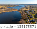 Beautiful view of Valdemarpils, Latvia with river and houses on a sunny day 135175571