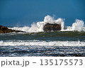 Waves crash powerfully against rocks near Essaouira, highlighting nature's beauty. 135175573