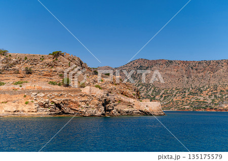Exploring the historical beauty of Spinalonga island in Crete, Greece under clear skies 135175579