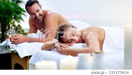 Love, spa and couple outdoor for massage, vacation and resting on table on a zen balcony. Relax, peace and man with woman at a luxury resort for wellness, treatment or body therapy, candles and wine 135175614
