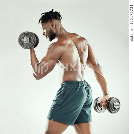 Exercise, strong and black man with dumbbells, workout goal and healthy guy on a white studio background. Male person, model or bodybuilder with gym equipment, strength and power with muscle and body 135175731