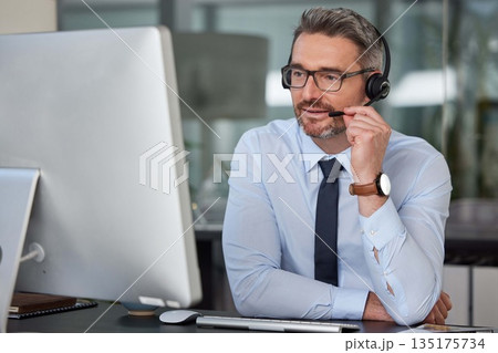 Businessman, call center and headphones on computer for customer service, telemarketing or support at office. Man, consultant or agent consulting on PC for online advice or telesales at the workplace Businessman, call center and headphones on computer for customer service, telemarketing or support at office. Man, consultant or agent consulting on PC for online advice or telesales at the workplace 135175734