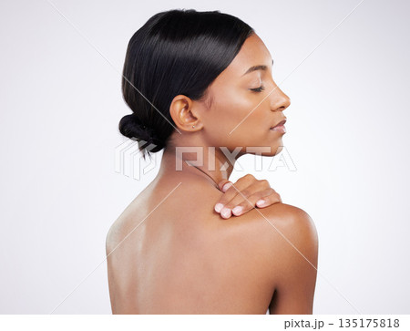 Woman, skincare and relaxed with back in studio for wellness, healthy glow and self care by white background. Indian model girl, skin health and soft touch with cosmetics, thinking and aesthetic Woman, skincare and relaxed with back in studio for wellness, healthy glow and self care by white background. Indian model girl, skin health and soft touch with cosmetics, thinking and aesthetic 135175818