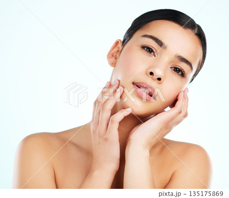 Face, beauty skincare and serious woman in studio isolated on a white background. Portrait, natural aesthetic and female model with cosmetics for spa facial treatment, healthy skin and wellness. 135175869