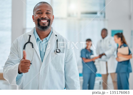 Thumbs up, doctor and portrait of black man with smile for medical help, insurance and trust in hospital. Healthcare, thank you sign and face of male health worker for service, consulting and care Thumbs up, doctor and portrait of black man with smile for medical help, insurance and trust in hospital. Healthcare, thank you sign and face of male health worker for service, consulting and care 135176063