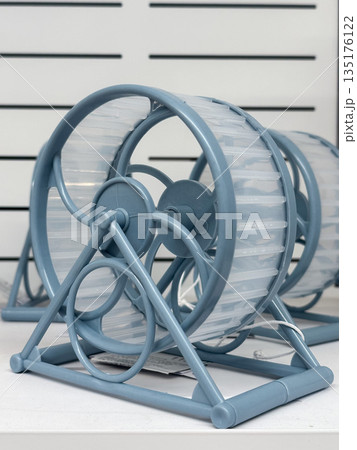 Hamster wheels for exercise in a pet cage setting Hamster wheels for exercise in a pet cage setting 135176122