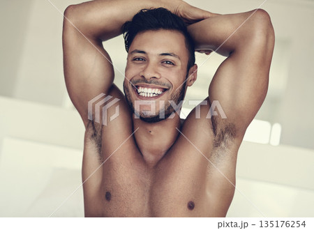 Smile, portrait of topless young man and in bedroom of his house. Self care or proud face, confident or positive mindset and shirtless male model with muscle health or wellness at home in Brazil 135176254