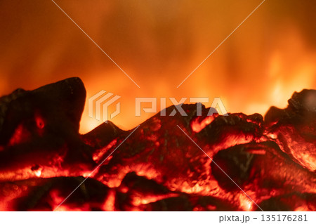 Close up of red hot burning coals 135176281