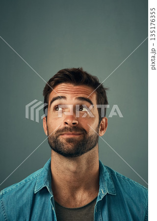 Man, face and thinking on mockup space for idea, plan or wondering against a grey studio background. Isolated thoughtful male person or model in question, doubt or confused mindset for planning dream Man, face and thinking on mockup space for idea, plan or wondering against a grey studio background. Isolated thoughtful male person or model in question, doubt or confused mindset for planning dream 135176355