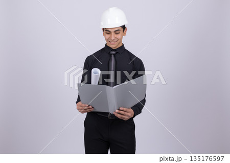 Professional man in black shirt holding folder Professional man in black shirt holding folder 135176597