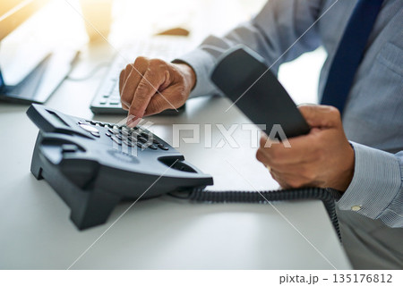 Hand, telephone and business man dial a number at work or on desk or call centre for customer service and In the office. Employee, telemarketing and receptionist or consulting and communication 135176812