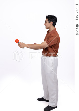 Man in a red shirt holding a tennis racket 135176821