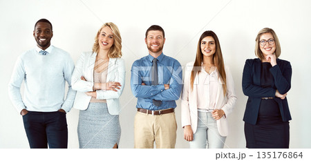 Portrait, law group and business people with arms crossed by white wall background in office workplace. Face, confident smile and lawyers standing together with teamwork, diversity and collaboration. Portrait, law group and business people with arms crossed by white wall background in office workplace. Face, confident smile and lawyers standing together with teamwork, diversity and collaboration. 135176864